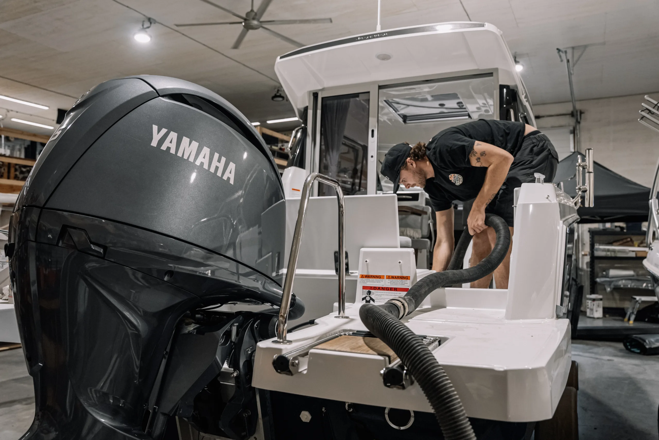 Our tech starting the installing process on a Jeanneau boat in the shop at UltraDeck