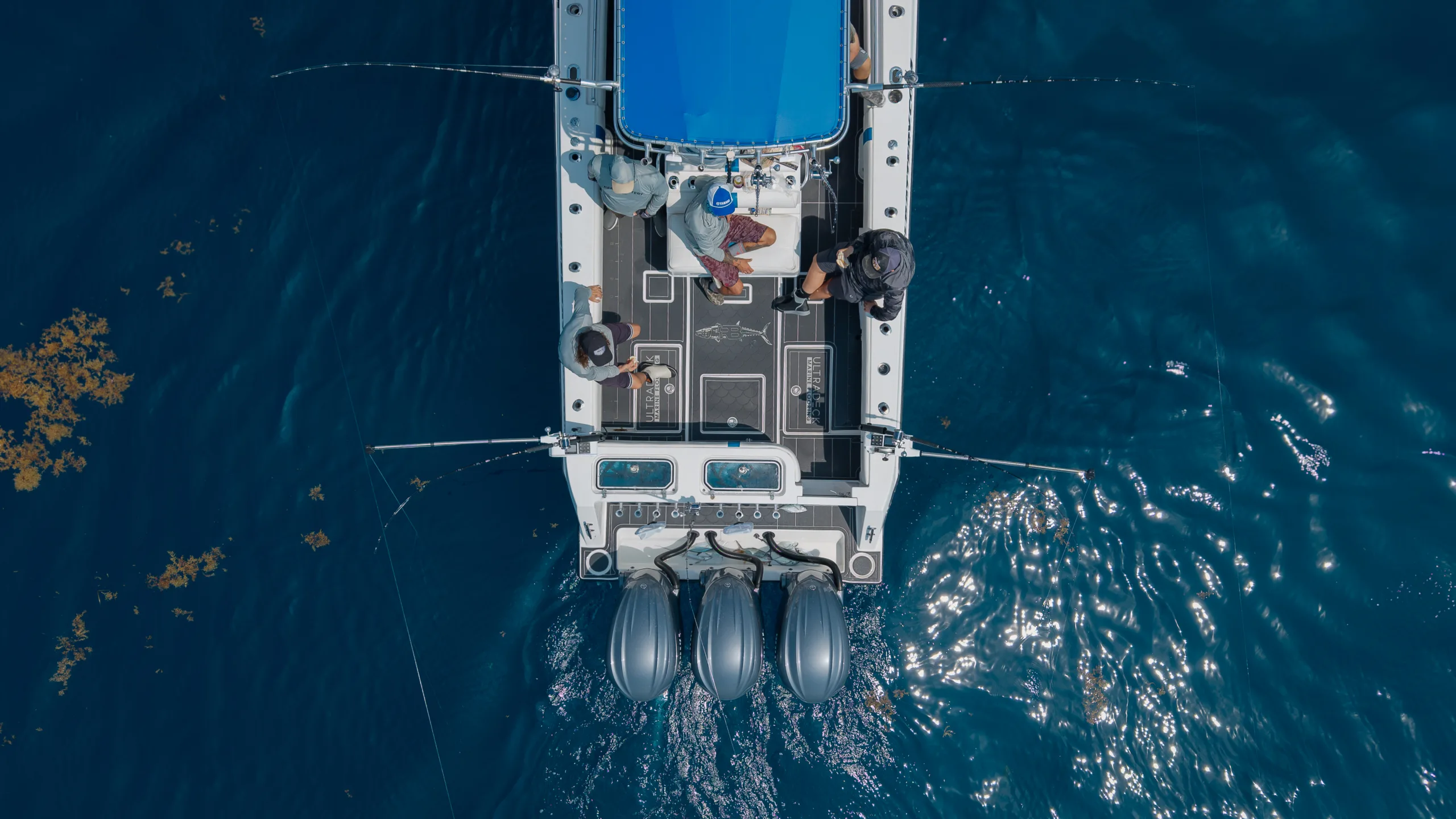 Drone shot of team reel battery boat showing the team fishing off the back with UltraDeck underfoot in Florida.